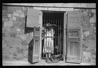 [Untitled photo, possibly related to: Charlotte Amalie, St. Thomas Island, Virgin Islands. An inmate of the insane asylum at the hospital]. Sourced from the Library of Congress.