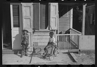 Children playing with their Christmas toys on a side street, Charlotte Amalie, St. Thomas, Virgin Islands. Sourced from the Library of Congress.