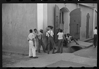 [Untitled photo, possibly related to: Boys playing on a street corner in Charlotte Amalie, Virgin Islands]. Sourced from the Library of Congress.