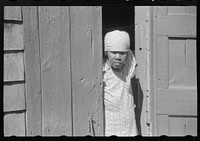 [Untitled photo, possibly related to: Charlotte Amalie, St. Thomas Island, Virgin Islands. Woman living in one of the bandbox houses]. Sourced from the Library of Congress.