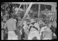 [Untitled photo, possibly related to: French Village, a small settlement on St. Thomas Island, Virgin Islands. French fishermen selling the day's catch]. Sourced from the Library of Congress.