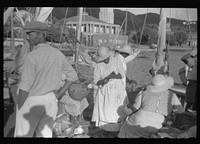 [Untitled photo, possibly related to: French Village, a small settlement on St. Thomas Island, Virgin Islands. French fishermen selling the day's catch]. Sourced from the Library of Congress.