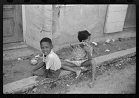 [Untitled photo, possibly related to: Charlotte Amalie, St. Thomas Island, Virgin Islands. Children playing in the street]. Sourced from the Library of Congress.