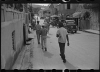 On a Saturday afternoon on one of the business streets in Christiansted, St. Croix, Virgin Islands. Sourced from the Library of Congress.