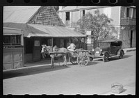 [Untitled photo, possibly related to: Along one of the shopping streets on a Saturday afternoon in Christiansted, St. Croix, Virgin Islands]. Sourced from the Library of Congress.