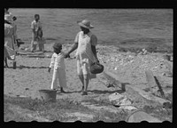 [Untitled photo, possibly related to: Buying produce at the waterfront in Christiansted. Most of the food comes in little schooners from Puerto Rico and the neighboring islands. Virgin Islands]. Sourced from the Library of Congress.