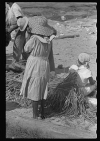 [Untitled photo, possibly related to: Buying produce at the waterfront in Christiansted. Most of the food comes in little schooners from Puerto Rico and the neighboring islands. Virgin Islands]. Sourced from the Library of Congress.