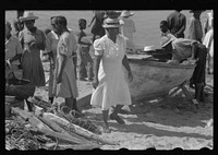 [Untitled photo, possibly related to: Buying produce at the waterfront in Christiansted. Most of the food comes in little schooners from Puerto Rico and the neighboring islands. Virgin Islands]. Sourced from the Library of Congress.