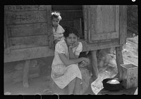 [Untitled photo, possibly related to: At the home of a farm laborer along the road in the hills near Yauco, Puerto Rico]. Sourced from the Library of Congress.