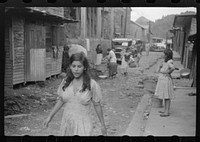 A street in the slum area of the hill town of Lares, Puerto Rico. Sourced from the Library of Congress.