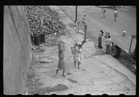 San Juan, Puerto Rico. People carrying water home because of the failure of the water system in San Juan for three days. Sourced from the Library of Congress.