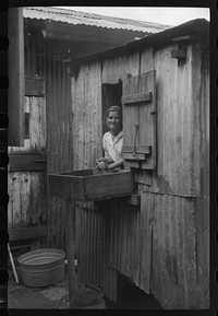 [Untitled photo, possibly related to: In the mill village at the sugar mill. Yabucoa, Puerto Rico]. Sourced from the Library of Congress.