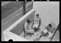 [Untitled photo, possibly related to: Family on terrace in Greenbelt, Maryland]. Sourced from the Library of Congress.