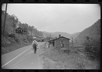 Carrying water to one of the houses in abandoned mining community, Marine, West Virginia. Sourced from the Library of Congress.