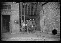 [Untitled photo, possibly related to: Miners turning in lamps and starting home. Caples, West Virginia]. Sourced from the Library of Congress.
