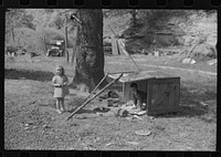 WPA (Works Progress Administration) worker's children with their toys in their play yard. South Charleston, West Virginia. Sourced from the Library of Congress.