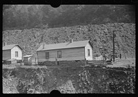 [Untitled photo, possibly related to: Coal miners' homes by slate and slag heap, Caples, West Virginia]. Sourced from the Library of Congress.