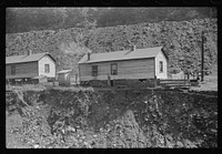 Coal miners' homes by slate and slag heap, Caples, West Virginia. Sourced from the Library of Congress.