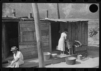 [Untitled photo, possibly related to: Playing checkers with bottle caps along highway between Charleston and Gauley Bridge, West Virginia]. Sourced from the Library of Congress.