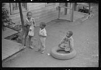 Coal miner's children play in front yard, Chaplin, West Virginia by Marion Post Wolcott
