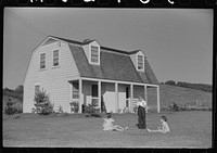 Children of homesteaders playing on their front lawn, Tygart Valley, West Virginia by Marion Post Wolcott