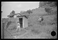 [Untitled photo, possibly related to: Neighbors take home slop for pig, also any extra corn. Bertha Hill, West Virginia]. Sourced from the Library of Congress.