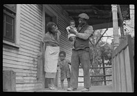 [Untitled photo, possibly related to: Coal miner, his wife and two of their children (note child's legs). Bertha Hill, West Virginia] by Marion Post Wolcott