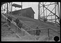 [Untitled photo, possibly related to: Coal miners going up to mine for the next trip, Maidsville, West Virginia]. Sourced from the Library of Congress.