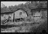 [Untitled photo, possibly related to: Shacks inhabited by es along river on highway between Charleston and Gauley Bridge, West Virginia]. Sourced from the Library of Congress.
