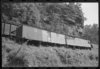 Old boxcars often converted into homes along highway between Charleston and Gauley Bridge, West Virginia. Sourced from the Library of Congress.