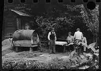 [Untitled photo, possibly related to: Bohemian miners (coal loaders) unemployed since mechanization of mines. Jere, West Virginia. They live together in one house with a woman housekeeper. All on relief. Spend most of their time fighting about politics. Call their dog "Hitler" because he's so mean and nasty. To the left is an outdoor oven for baking bread. Abandoned mining town] by Marion Post Wolcott