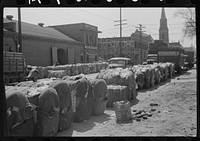 Bales of cotton on street outside warehouse, Montgomery, Alabama. Sourced from the Library of Congress.