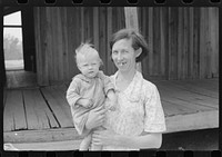 Mrs. Ellis Adkins and her youngest child. The family are rehabilitation borrowers. There are seven children and this is their first year on the program. Coffee County, Alabama. Sourced from the Library of Congress.