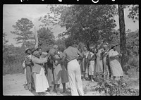 [Untitled photo, possibly related to: Juanita Coleman helps during recreation time for adult class. In the church she teaches them to read and write and to discuss any interests and problems. Gees Bend, Alabama]. Sourced from the Library of Congress.