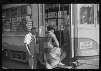 [Untitled photo, possibly related to: Domestic servants waiting for street car on way to work early in the morning. Mitchell Street, Atlanta, Georgia]. Sourced from the Library of Congress.