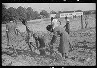 [Untitled photo, possibly related to: Behind the homemade plow in the school garden, Gees Bend, Alabama]. Sourced from the Library of Congress.