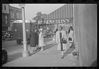 Salesgirl leaving work, Atlanta, Georgia. Sourced from the Library of Congress.