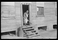 [Untitled photo, possibly related to: Mixed-breed Indian, white and , near Pembroke Farms, making new chair seat. North Carolina]. Sourced from the Library of Congress.