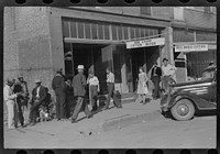 Cotton offices, main street, Saturday afternoon, Belzoni, Mississippi Delta, Mississippi. Sourced from the Library of Congress.