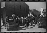 [Untitled photo, possibly related to: Some of the es watching itinerant salesman selling goods from his truck in center of town on Saturday afternoon, Belzoni, Mississippi Delta, Mississippi]. Sourced from the Library of Congress.