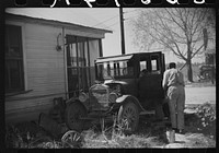 [Untitled photo, possibly related to: Uncle George who has worked on Marcella Plantation in smith and carpentry shop for last fifty years after he got out of prison, fixing his old car, Mileston, Mississippi Delta, Mississippi]. Sourced from the Library of Congress.