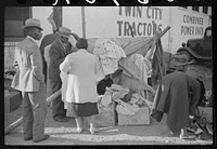 [Untitled photo, possibly related to: People buying secondhand clothing with the money they earned picking cotton. Clarksdale, Mississippi Delta, Mississippi]. Sourced from the Library of Congress.