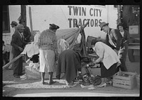 es buying secondhand clothing with the money they earned picking cotton. Clarksdale, Mississippi Delta, Mississippi. Sourced from the Library of Congress.
