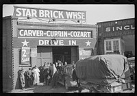 [Untitled photo, possibly related to: Tobacco on trailer being brought into star brick warehouse,for auction sale, Durham, North Carolina]. Sourced from the Library of Congress.