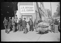 [Untitled photo, possibly related to: Outside tobacco warehouse after auction sale. Durham, North Carolina]. Sourced from the Library of Congress.