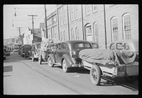 [Untitled photo, possibly related to: Farmers bringing tobacco to warehouse in trailers, on top of their cars and even inside their cars for auction. Durham, North Carolina]. Sourced from the Library of Congress.