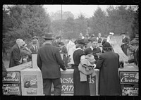 Spectators at refreshment stand during the halves of the Duke University-North Carolina football game. Durham, North Carolina. Sourced from the Library of Congress.