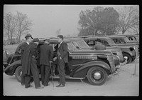 [Untitled photo, possibly related to: Cars parked outside the stadium at the Duke University-North Carolina football game. Durham, North Carolina] by Marion Post Wolcott