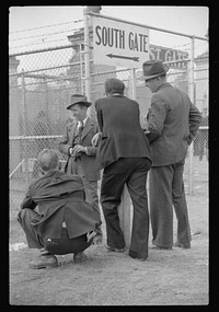 Spectators outside of the stadium at the Duke University-North Carolina football game. Durham, North Carolina. Sourced from the Library of Congress.