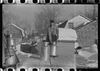 Farmers near Woodstock, Vermont, bring their cans of milk to the crossroads early every morning where it is picked up by the coop farmers' truck and is taken to the city. Sourced from the Library of Congress.